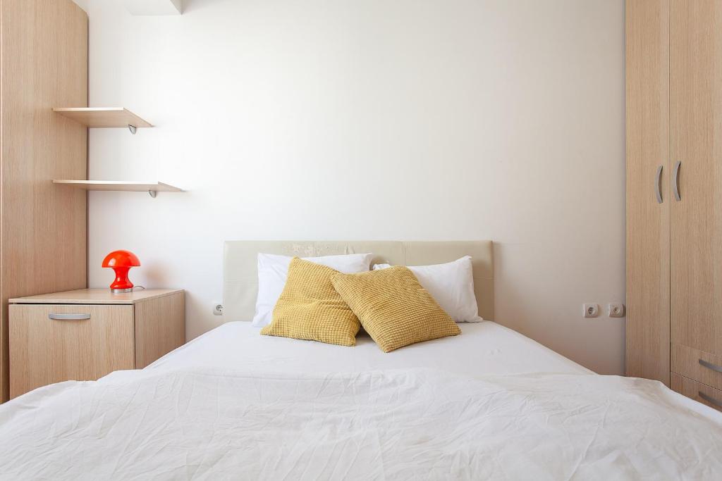 Postel nebo postele na pokoji v ubytování Urban Hostel & Apartments