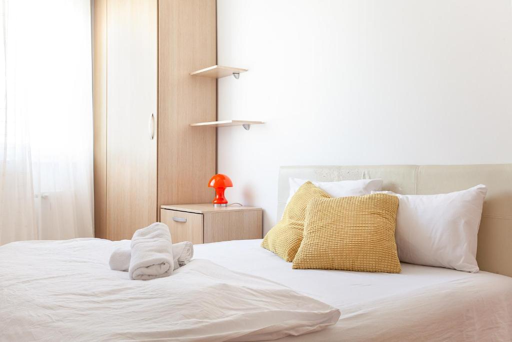Postel nebo postele na pokoji v ubytování Urban Hostel & Apartments