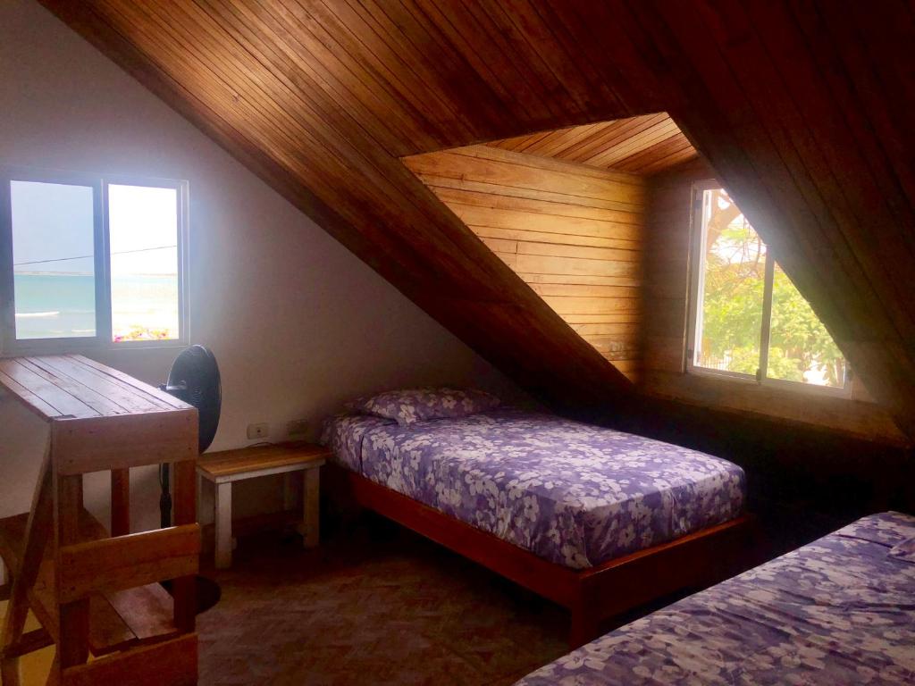 Postel nebo postele na pokoji v ubytování Hotel Santorini