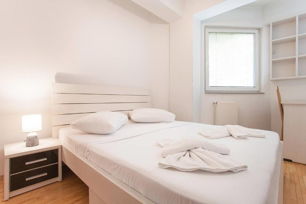 Postel nebo postele na pokoji v ubytování Urban Hostel & Apartments