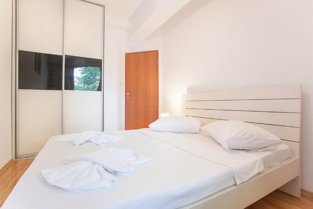 Postel nebo postele na pokoji v ubytování Urban Hostel & Apartments