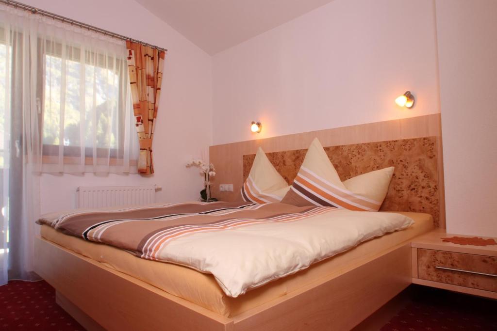 Postel nebo postele na pokoji v ubytování Chalet Walzl