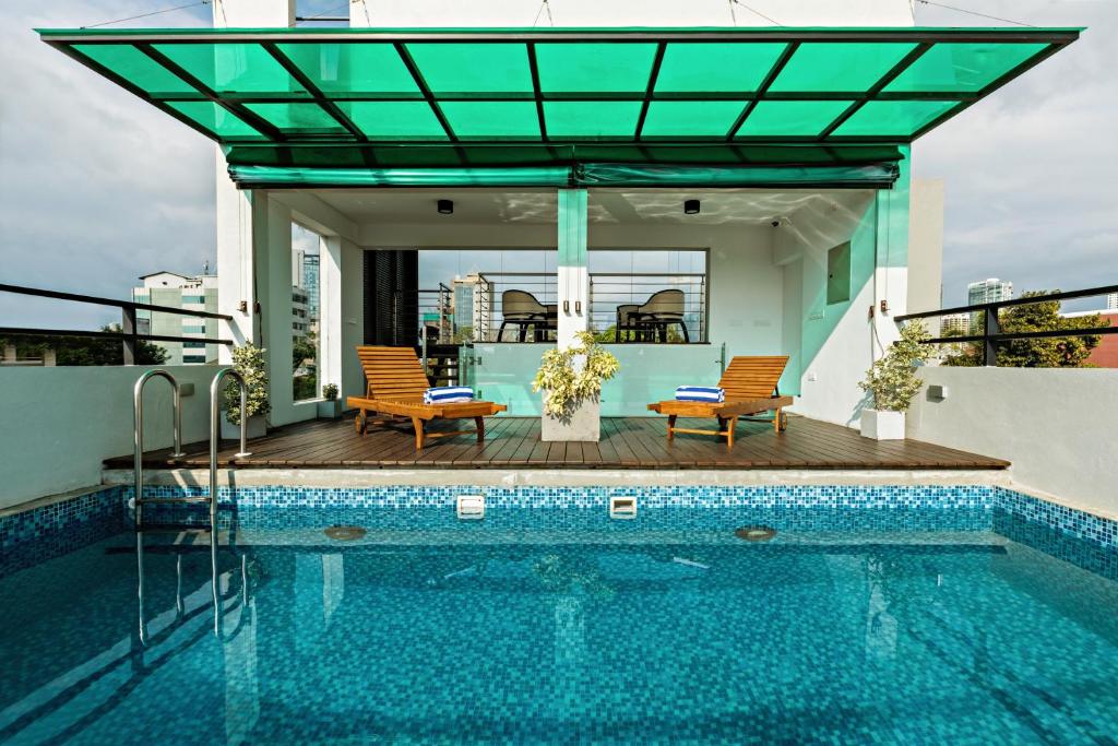 a house with a swimming pool on top of a building at Lavonca Boutique Hotel in Colombo