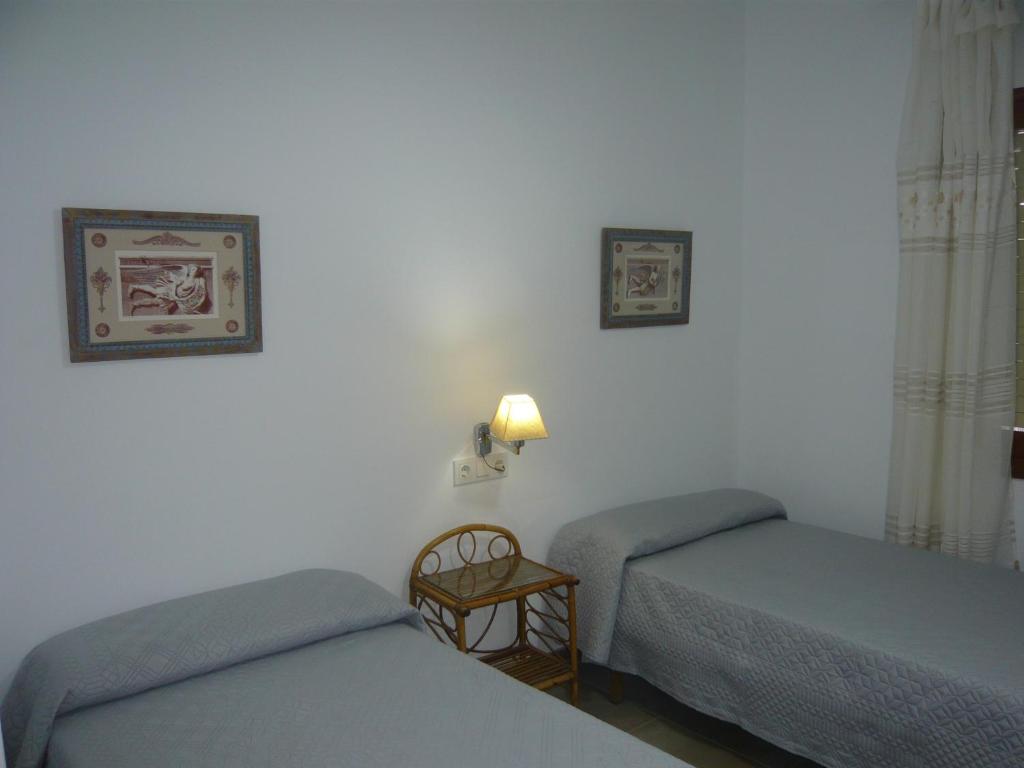 Postel nebo postele na pokoji v ubytování Chalet II con jardín y wifi en la playa