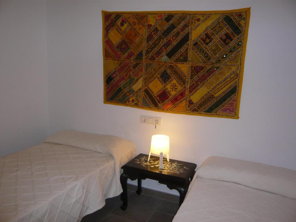 Postel nebo postele na pokoji v ubytování Chalet II con jardín y wifi en la playa