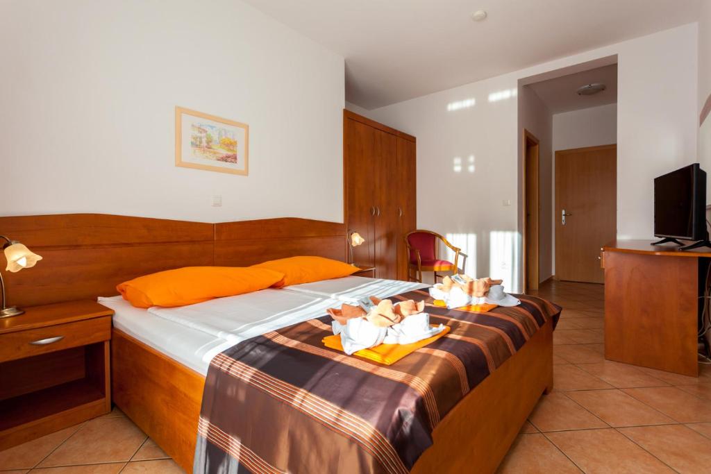 Postel nebo postele na pokoji v ubytování Guesthouse Villa Adria
