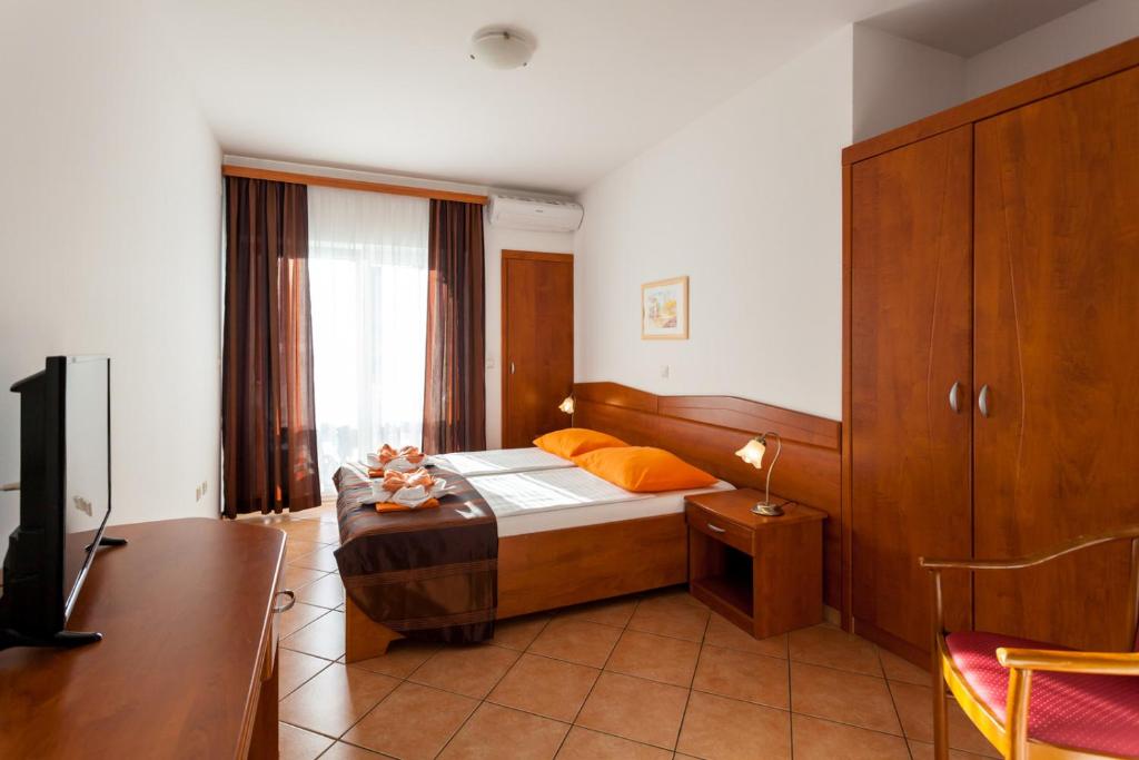 Postel nebo postele na pokoji v ubytování Guesthouse Villa Adria