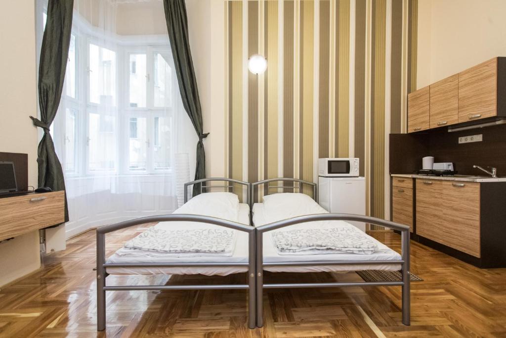 ブダペストにあるRiverside Cityのベッドルーム1室(ベッド1台付)