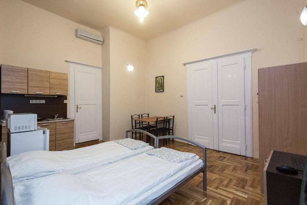 Posteľ alebo postele v izbe v ubytovaní Riverside City