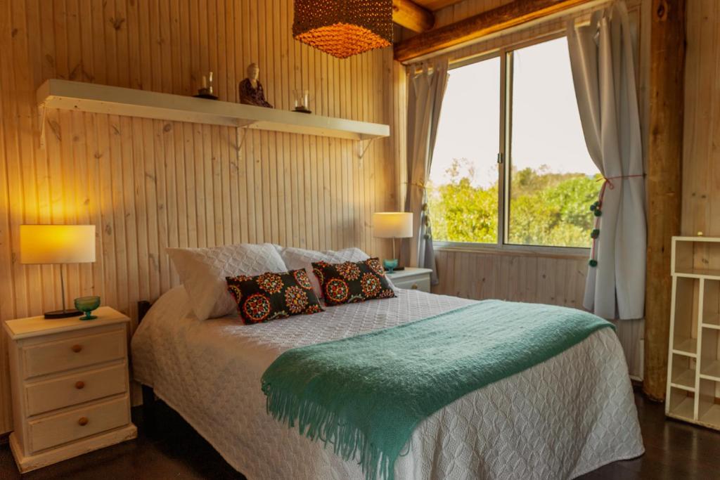 a bedroom with a bed and a window at BDL Beach Design loft Two in José Ignacio