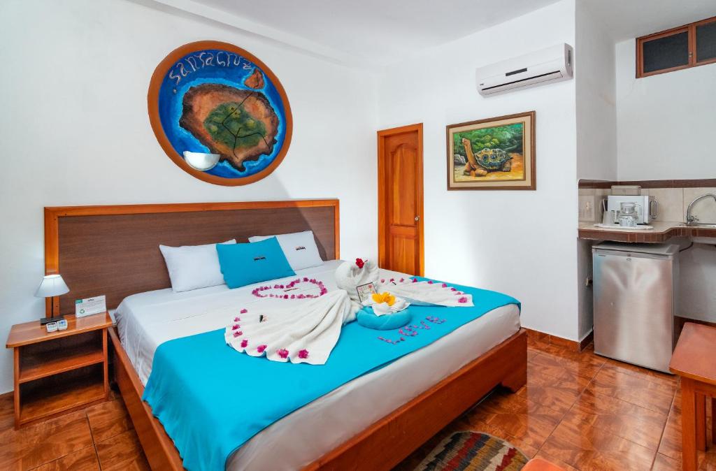 Postel nebo postele na pokoji v ubytování Hotel Coloma Galapagos