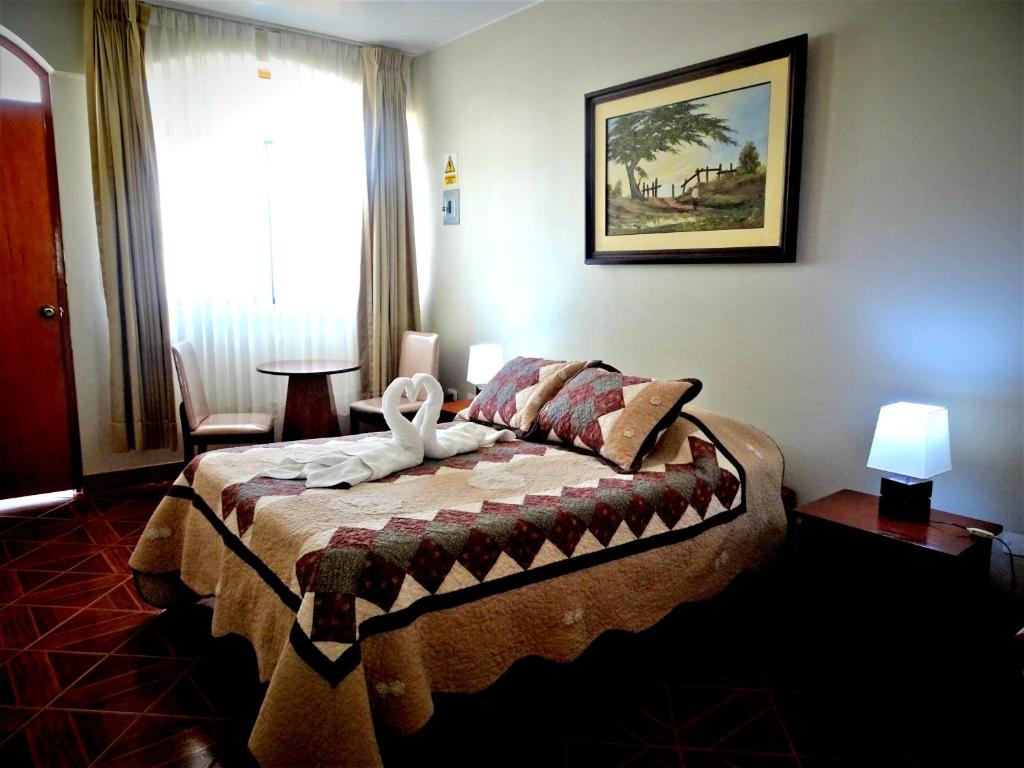 Postel nebo postele na pokoji v ubytování Hotel Curasi