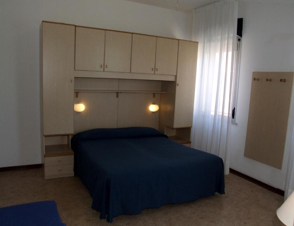 Postel nebo postele na pokoji v ubytování Hotel Firenze