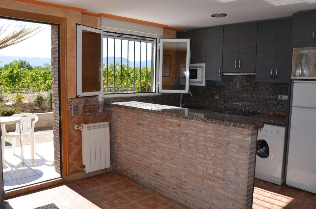 A kitchen or kitchenette at Apartamentos Matraca