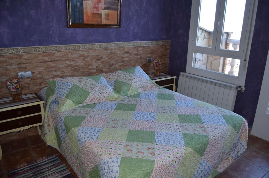 A bed or beds in a room at Apartamentos Matraca