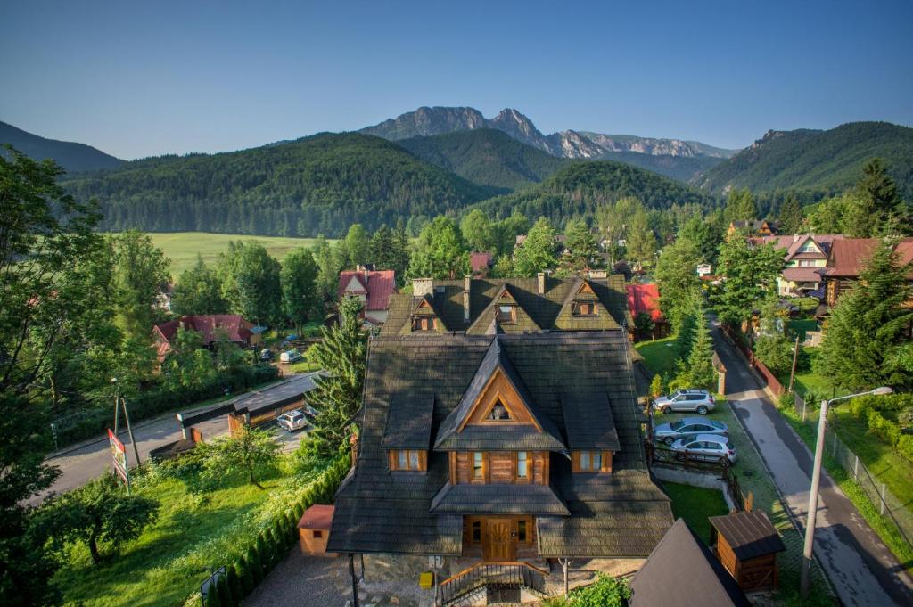 an aerial view of a house with mountains in the background at Willa Olga in Zakopane