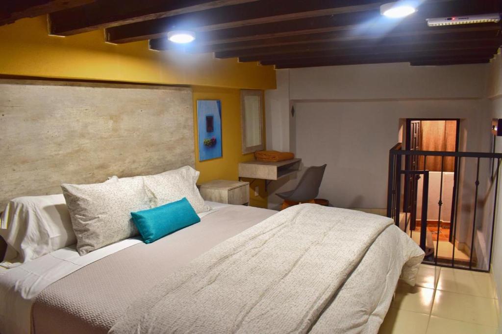 Postel nebo postele na pokoji v ubytování Hotel Corazón Mexicano