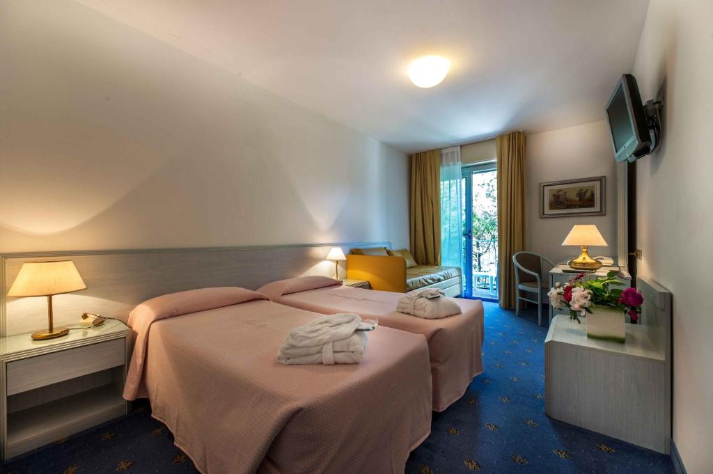 Postel nebo postele na pokoji v ubytování Hotel Meridianus
