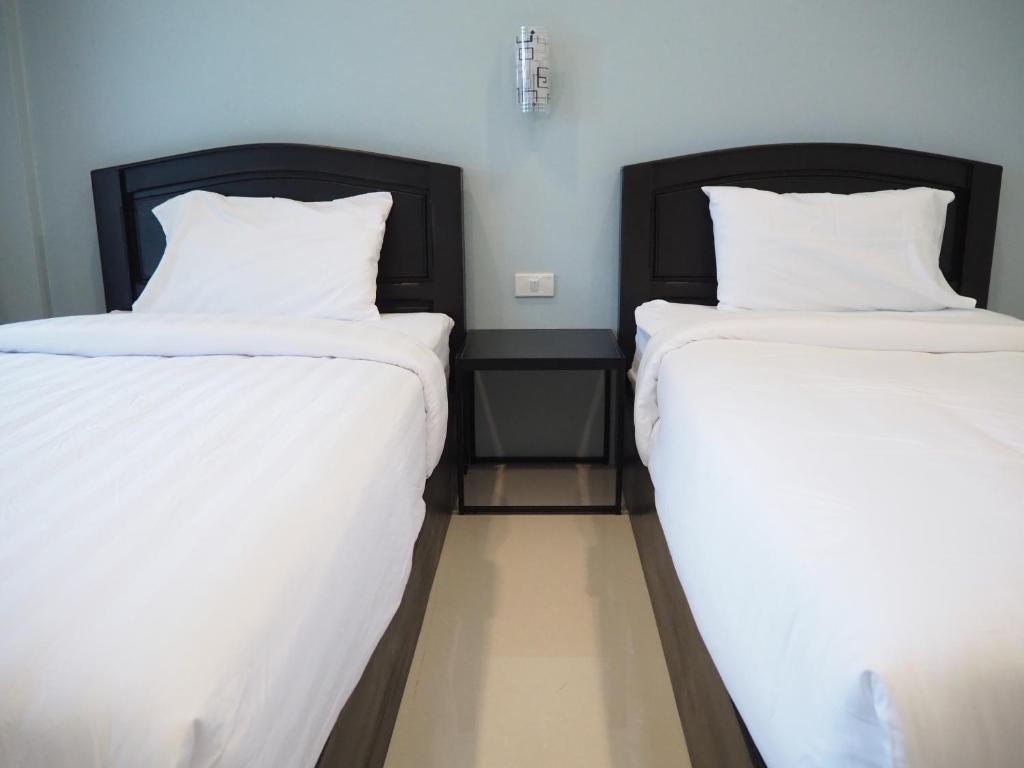 Postel nebo postele na pokoji v ubytování Kangsadan Resort