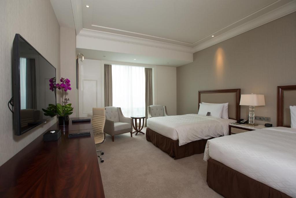TV a/nebo společenská místnost v ubytování Jeurong Hotel Shanghai