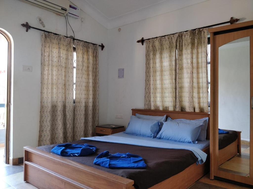 Postel nebo postele na pokoji v ubytování Koito-House calangute guest house