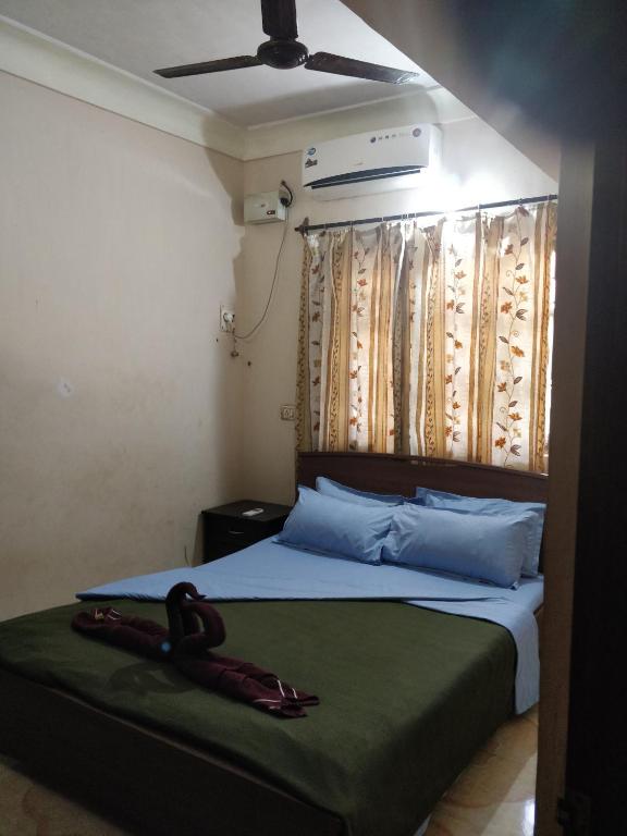 Postel nebo postele na pokoji v ubytování Koito-House calangute guest house