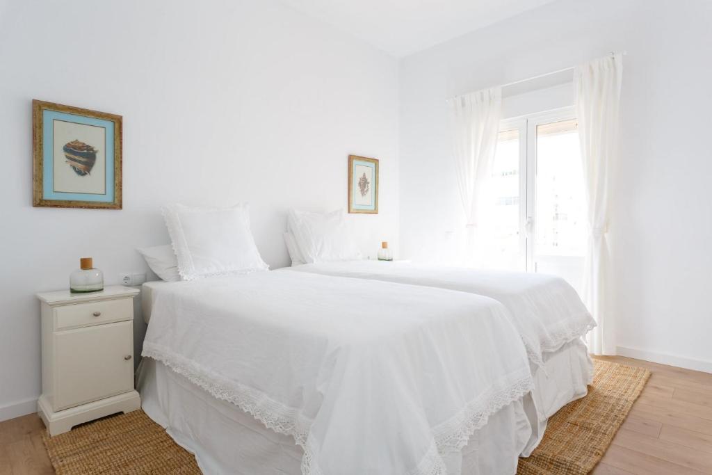 Posteľ alebo postele v izbe v ubytovaní FARO Family Home by Cadiz4Rentals