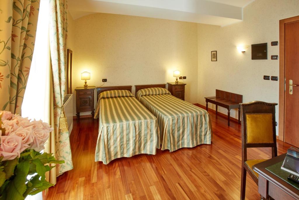 Postel nebo postele na pokoji v ubytování Liberty Hotel