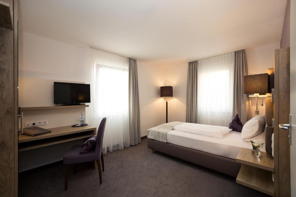 Postel nebo postele na pokoji v ubytování DasSchaffers - MeinWohlfühlhotel