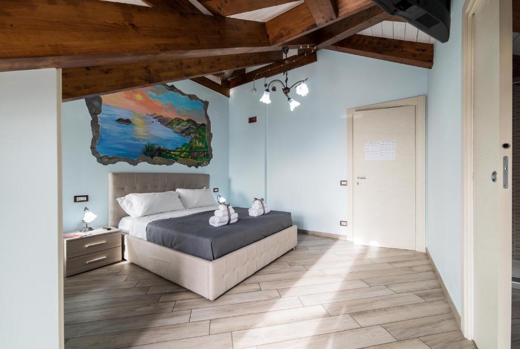 Postel nebo postele na pokoji v ubytování B&B Kebontà