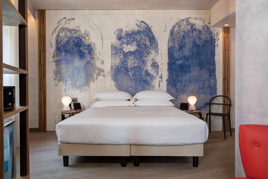 Postel nebo postele na pokoji v ubytování Hotel Firenze