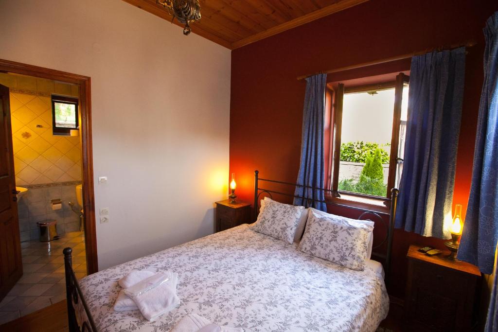 Postel nebo postele na pokoji v ubytování Hotel Machalas