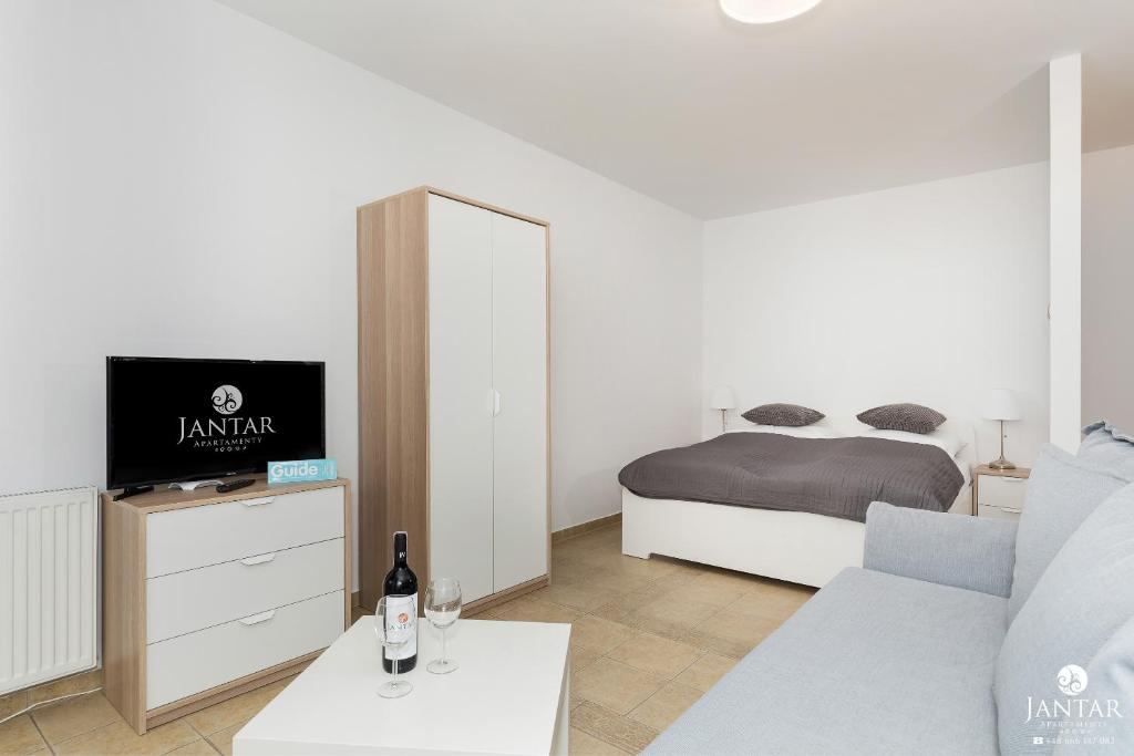 Posteľ alebo postele v izbe v ubytovaní Jantar Apartamenty- Zielone Tarasy