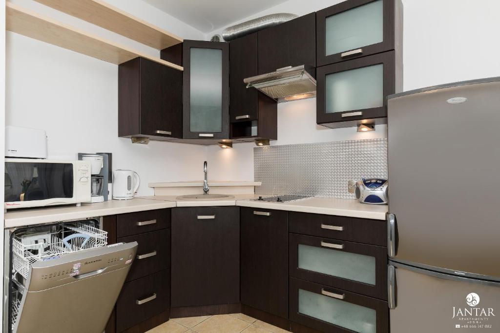 Kuchyňa alebo kuchynka v ubytovaní Jantar Apartamenty- Zielone Tarasy