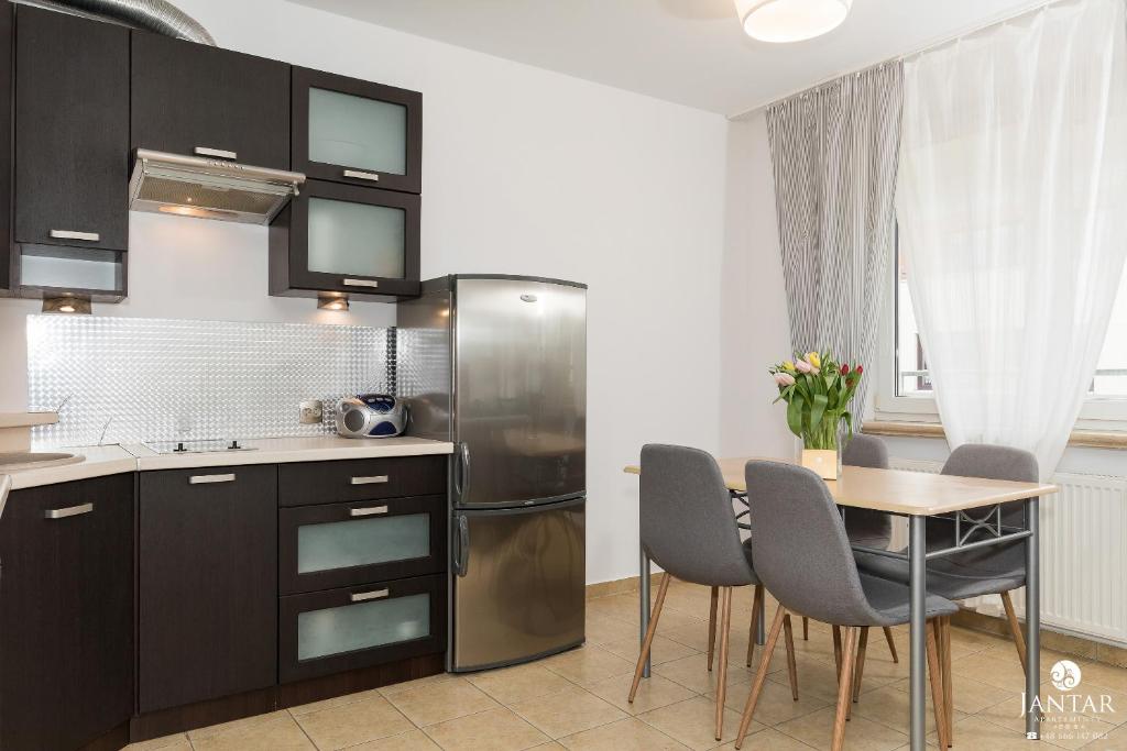 Kuchyňa alebo kuchynka v ubytovaní Jantar Apartamenty- Zielone Tarasy