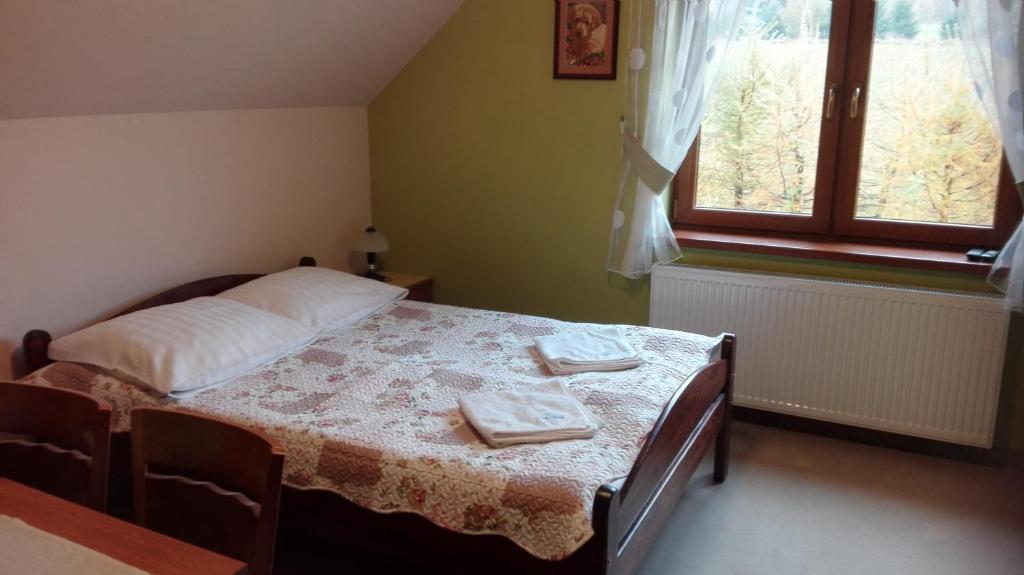 Posteľ alebo postele v izbe v ubytovaní Pokoje Gościnne Pod Wysotą