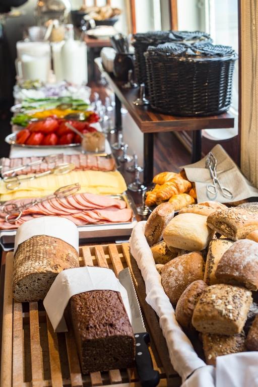 a buffet with lots of different types of bread at Mälardrottningen Yacht Hotel in Stockholm