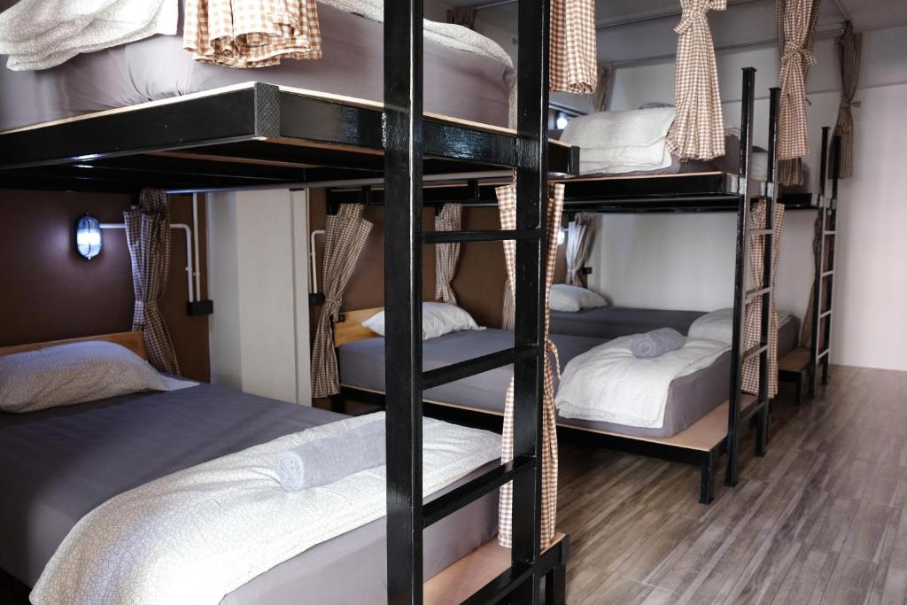 Postel nebo postele na pokoji v ubytování Tangmo House