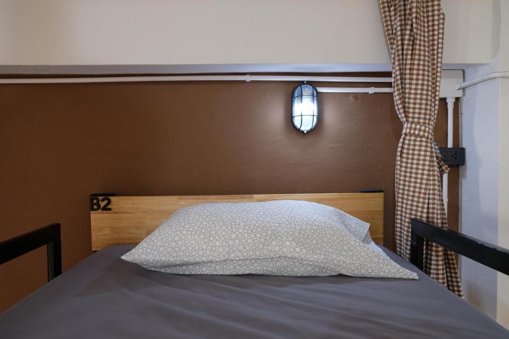 Postel nebo postele na pokoji v ubytování Tangmo House