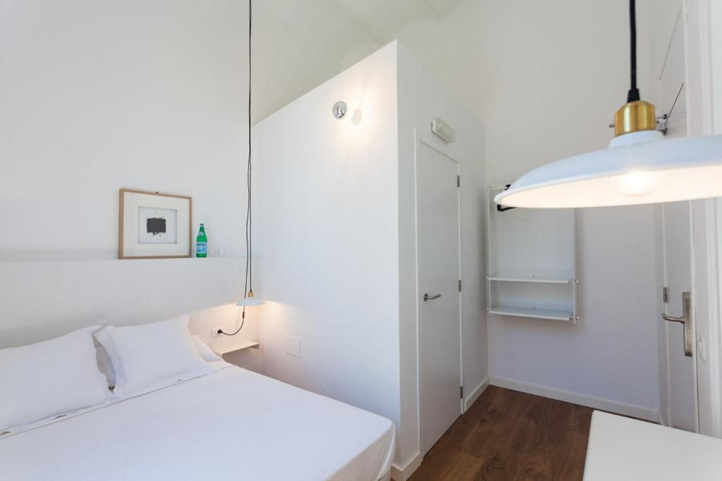 Posteľ alebo postele v izbe v ubytovaní Hostal Argo