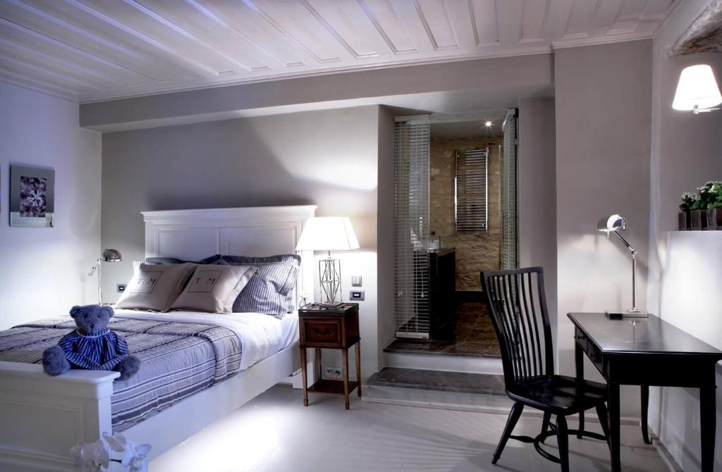 Postel nebo postele na pokoji v ubytování Torri E Merli Boutique Hotel