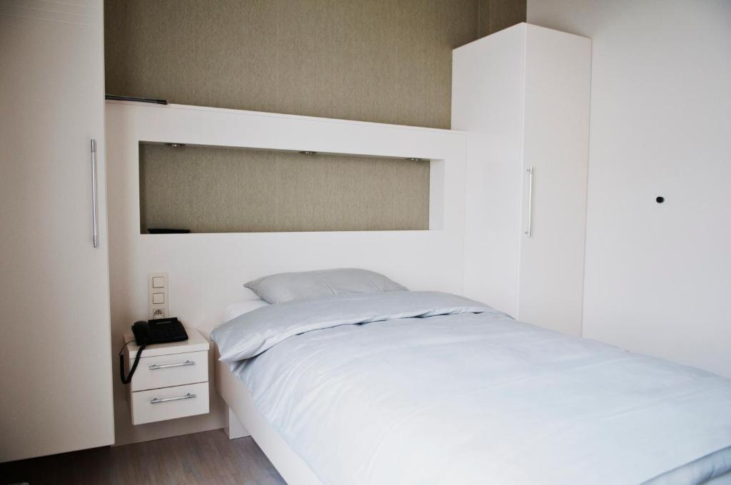 Postel nebo postele na pokoji v ubytování Belrom Hotel