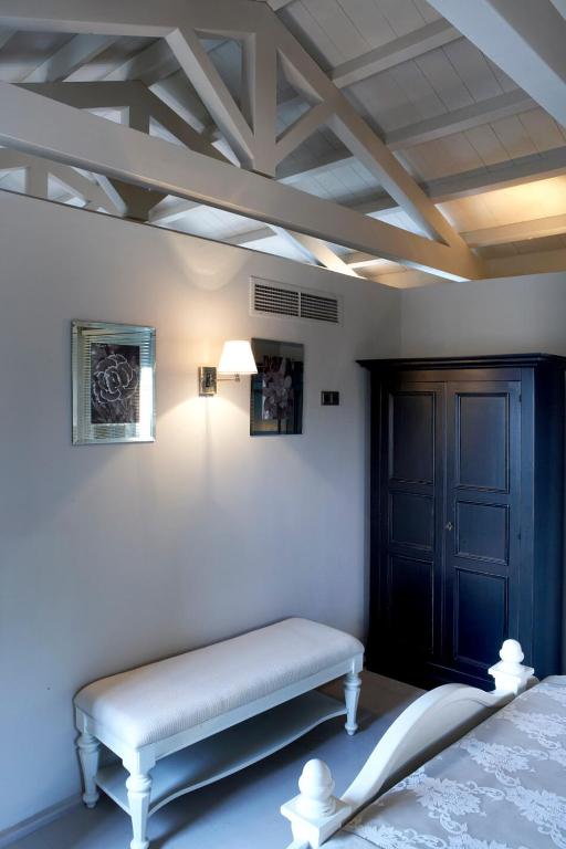 Postel nebo postele na pokoji v ubytování Torri E Merli Boutique Hotel