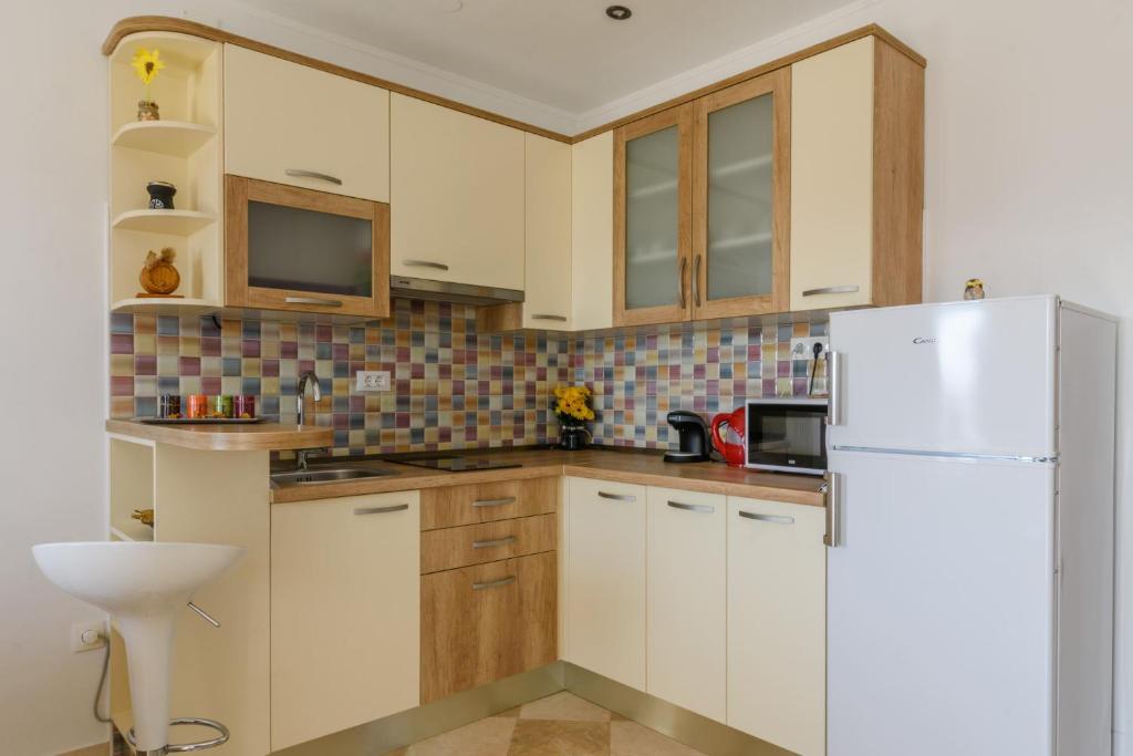 Kuchyň nebo kuchyňský kout v ubytování La Bodega Apartments