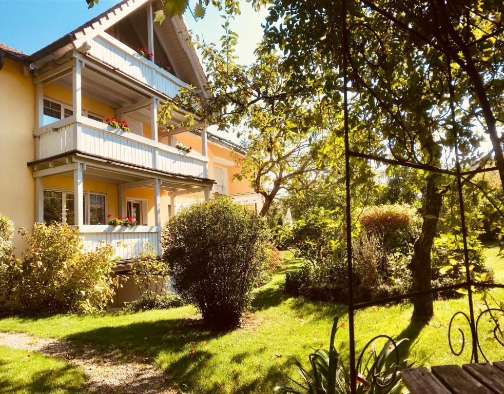 a house with a yard in front of it at Apartment Johanna in Radolfzell am Bodensee