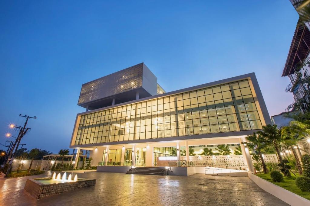 a large building with a lot of windows at Paragon Grand Resort in Jomtien Beach