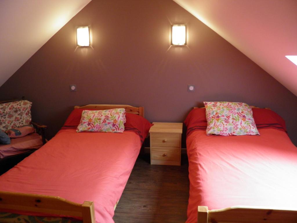 Una cama o camas en una habitación de Auberge des Pyrénées