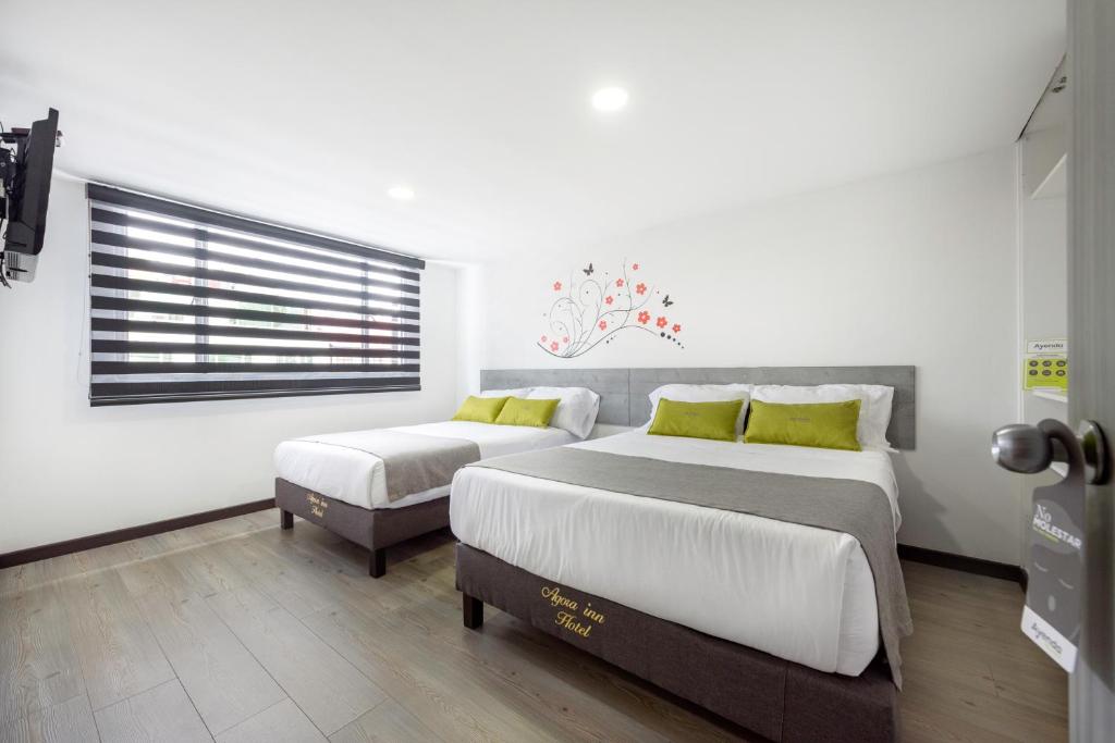 Ayenda 1024 Agora Inn Hotel - Quadruple Chambre