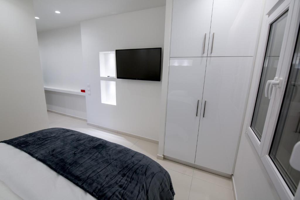 Łóżko lub łóżka w pokoju w obiekcie White Lux Apartment For 2 VIPGreece