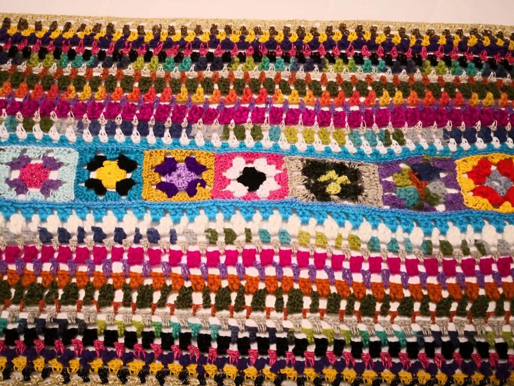a close up of a colorful crochet blanket at Hotel Salento 1842 in Salento